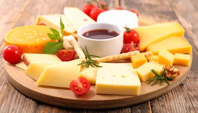 Gourmet Cheese Platter With Honey And Vegetables
