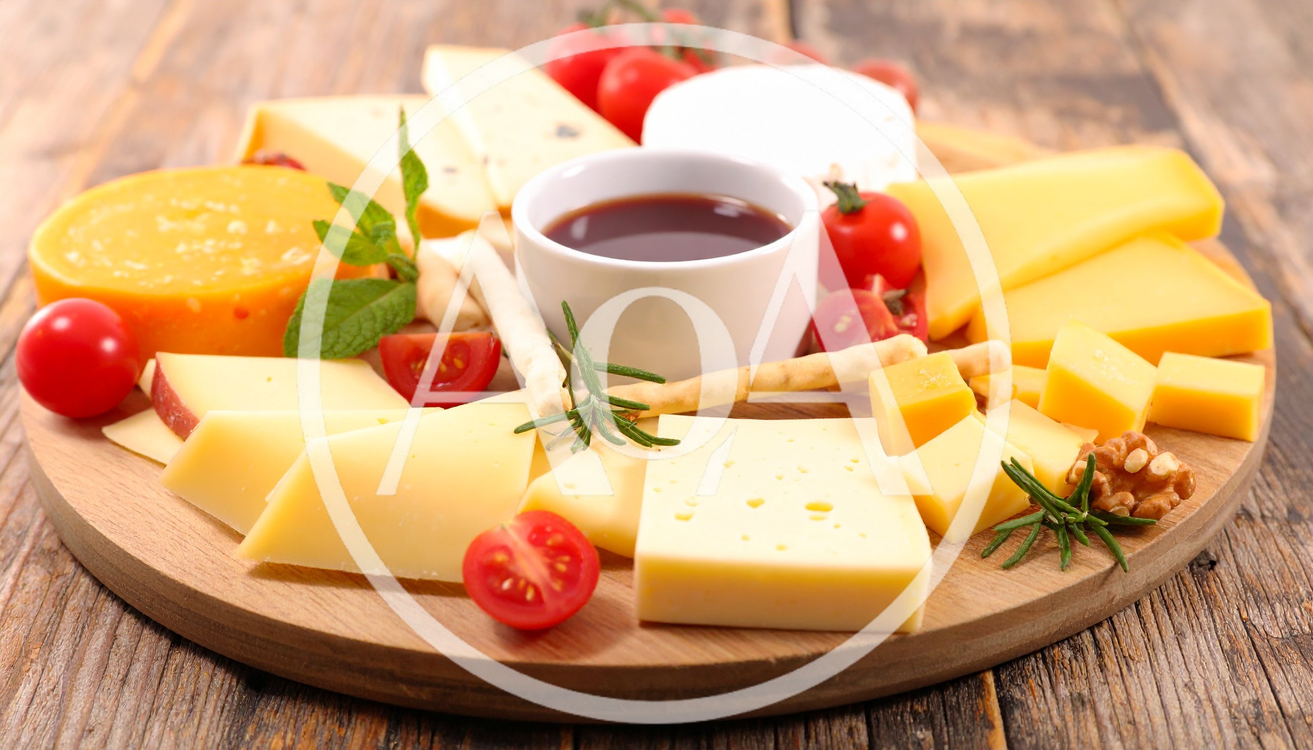 Gourmet Cheese Platter With Honey And Vegetables