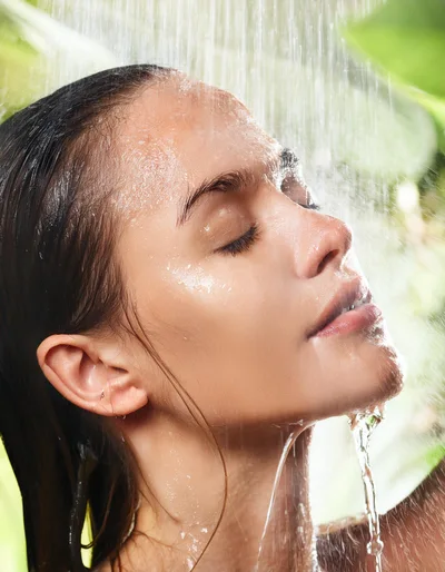 Young Woman Enjoying A Refreshing Outdoor Shower