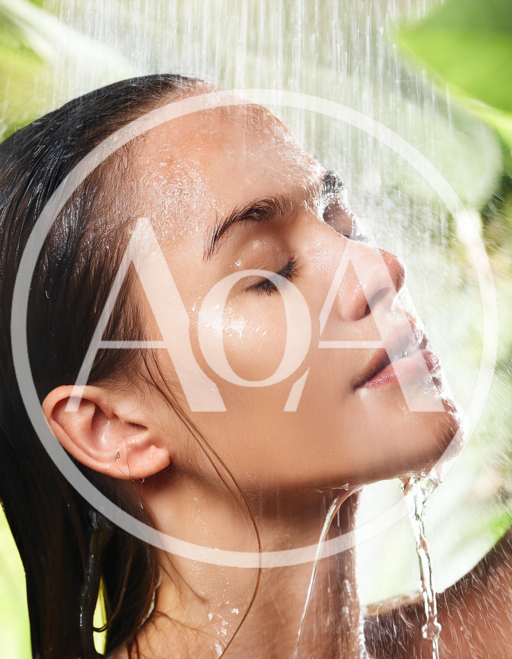 Young Woman Enjoying A Refreshing Outdoor Shower