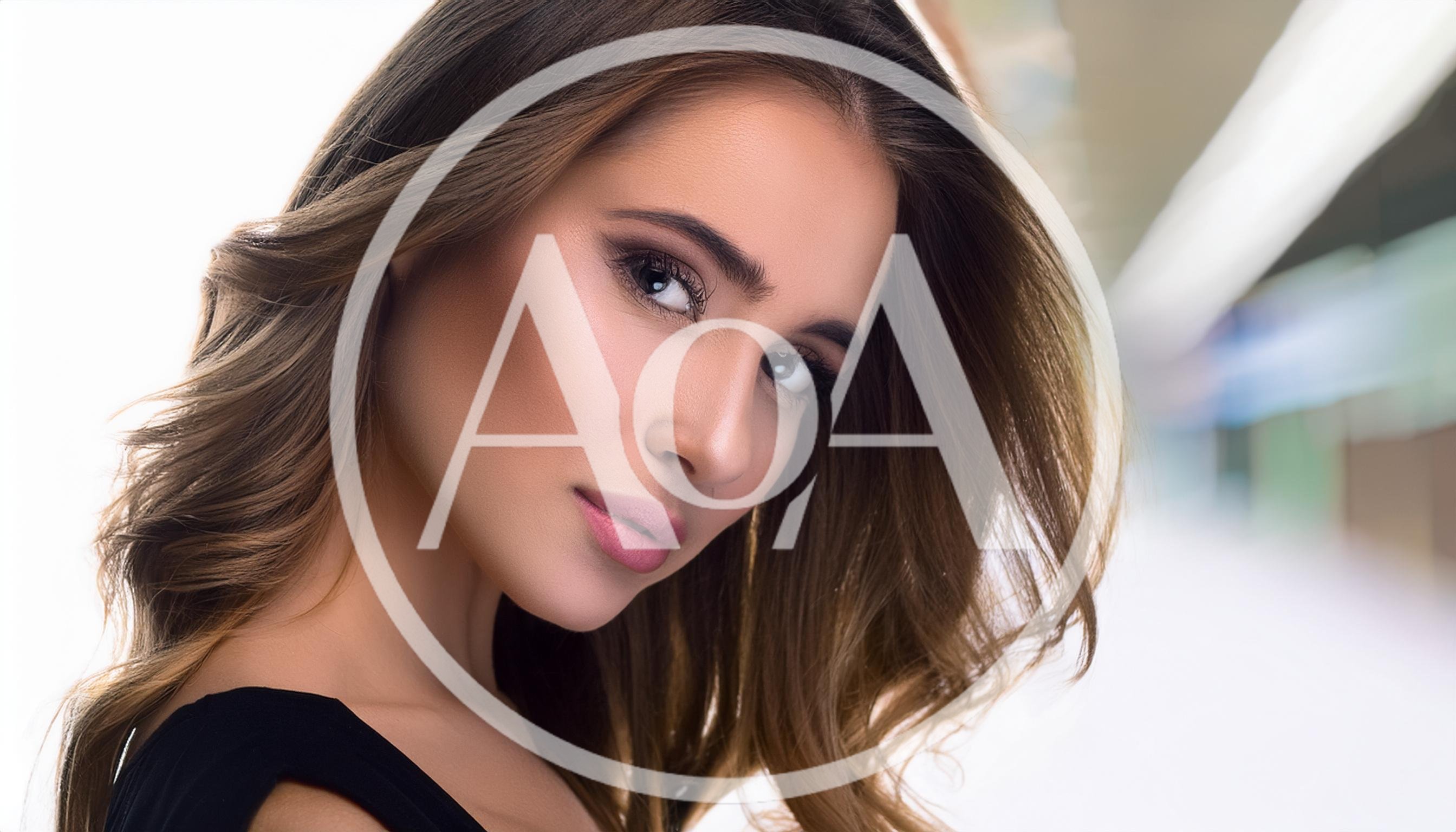 Portrait Of A Beautiful Young Woman With Wavy Hair