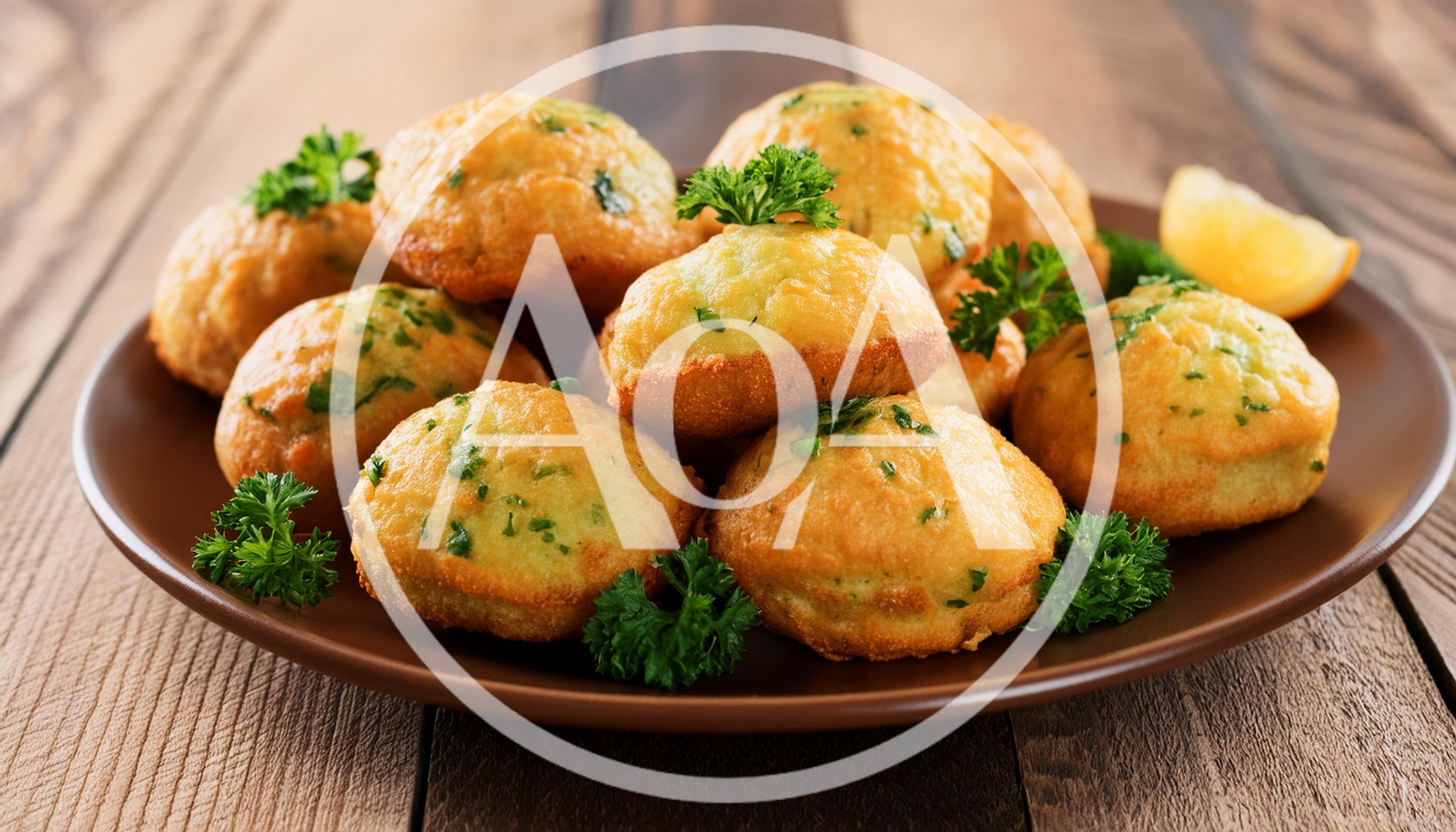 Savory Herb Muffins Served On A Brown Plate
