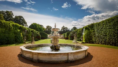 Ornate Stone Fountain In A Formal English Garden
