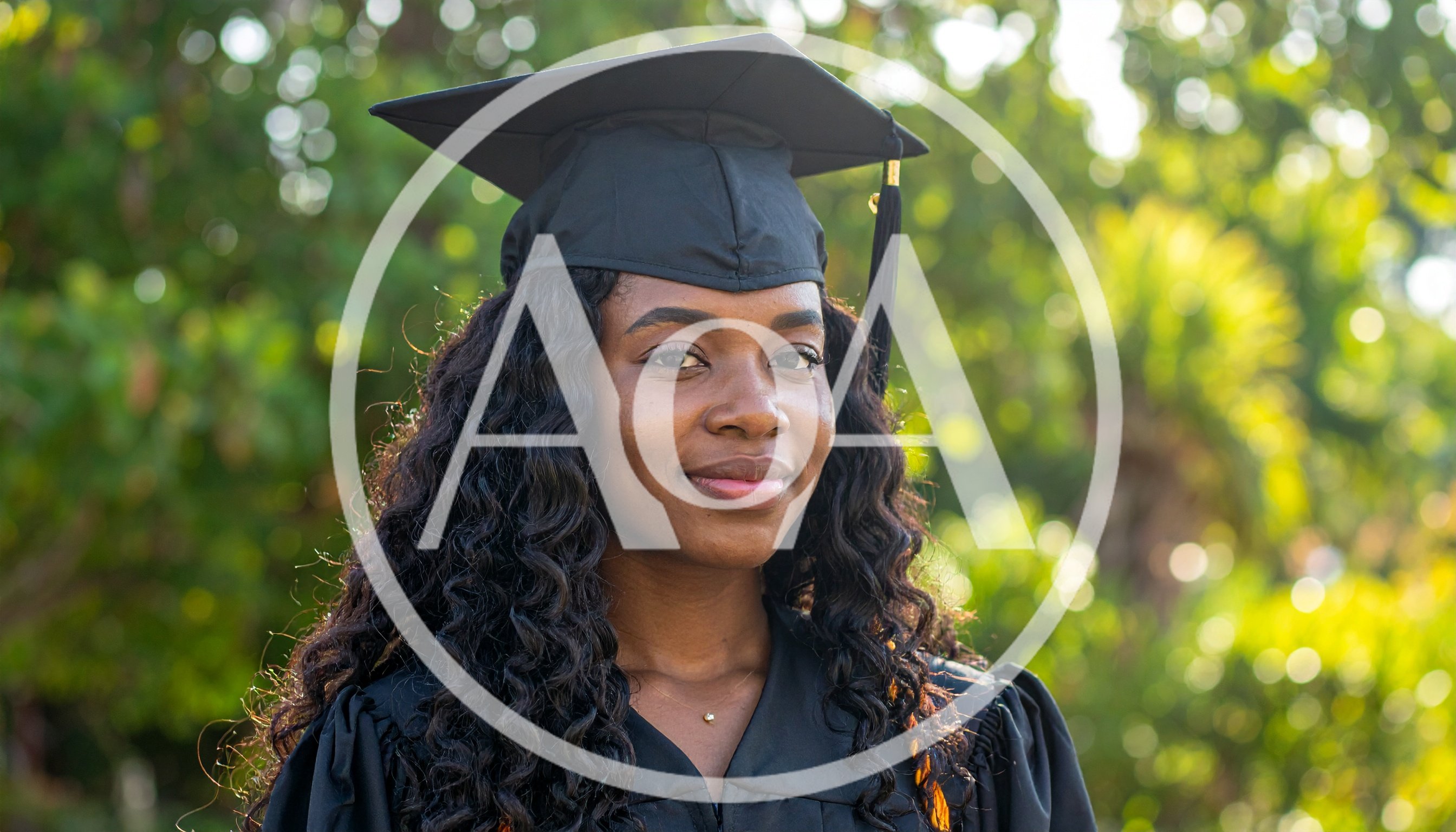 Young Black Woman Wearing Graduation Cap and Gown