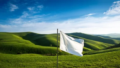 White Flag Waving Over Rolling Green Hills