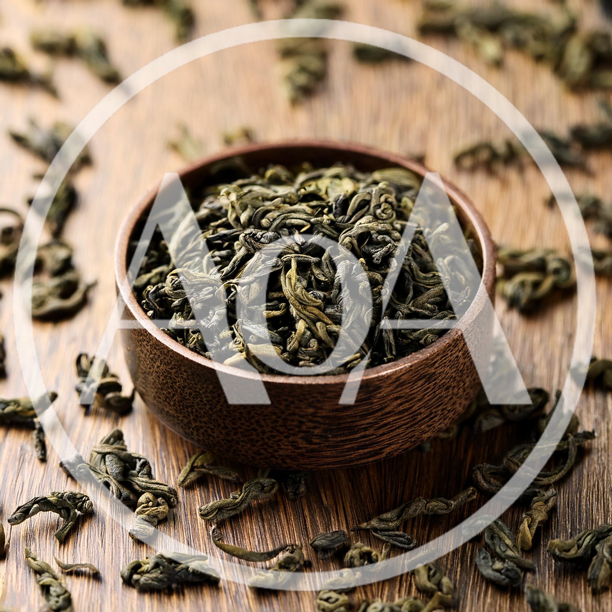 Dried Green Tea Leaves In A Wooden Bowl