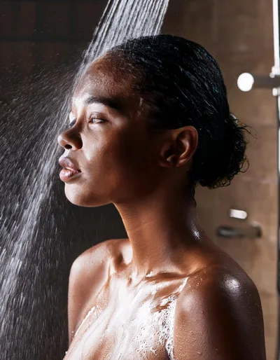 Young Black Woman Taking A Refreshing Shower