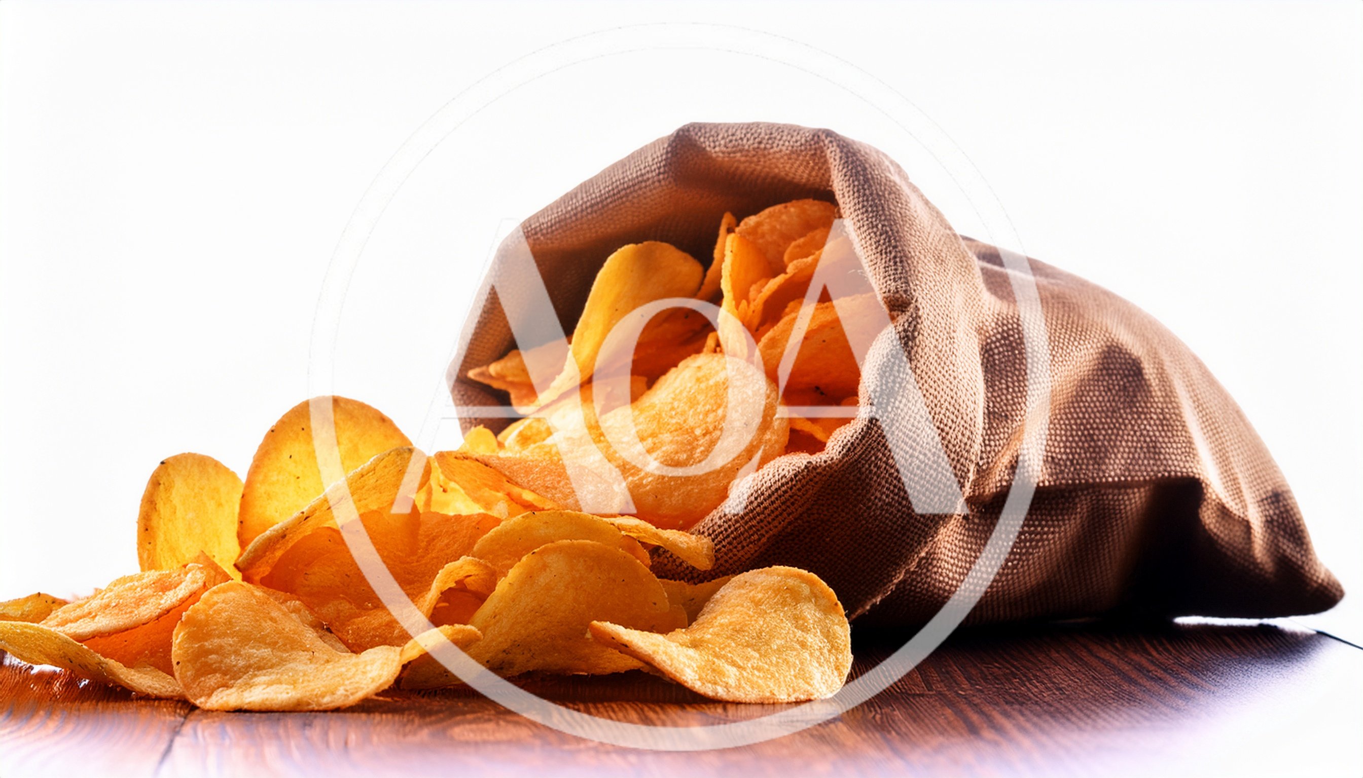 Potato Chips Spilling From A Burlap Sack
