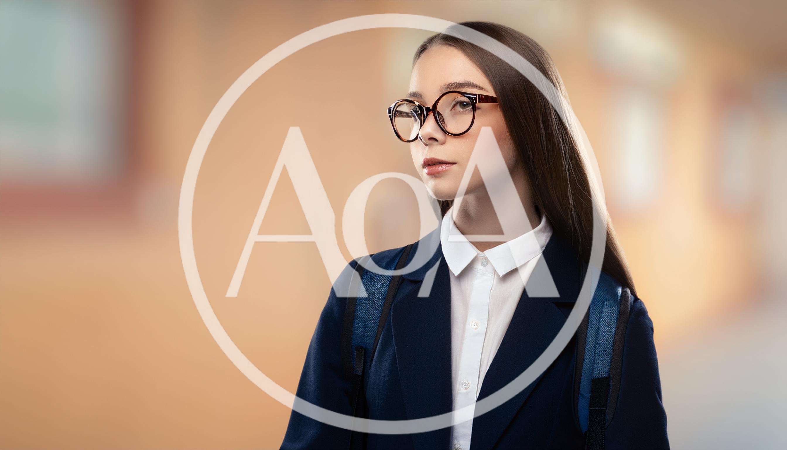 Young Female Student Wearing Glasses And School Uniform