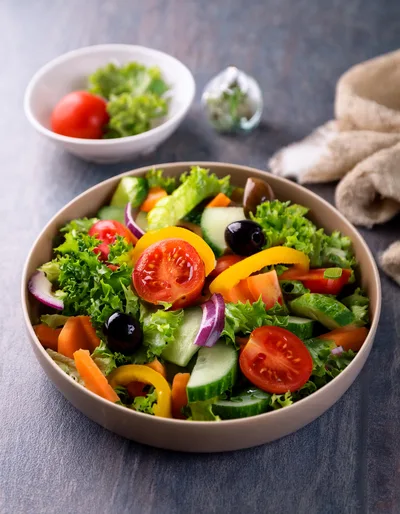 Fresh Vegetable Salad In A Ceramic Bowl