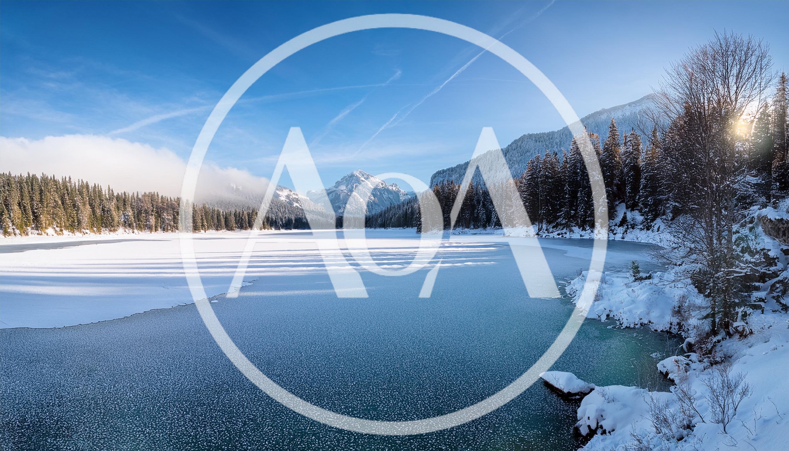 Winter Landscape With Frozen Lake And Snowy Mountains