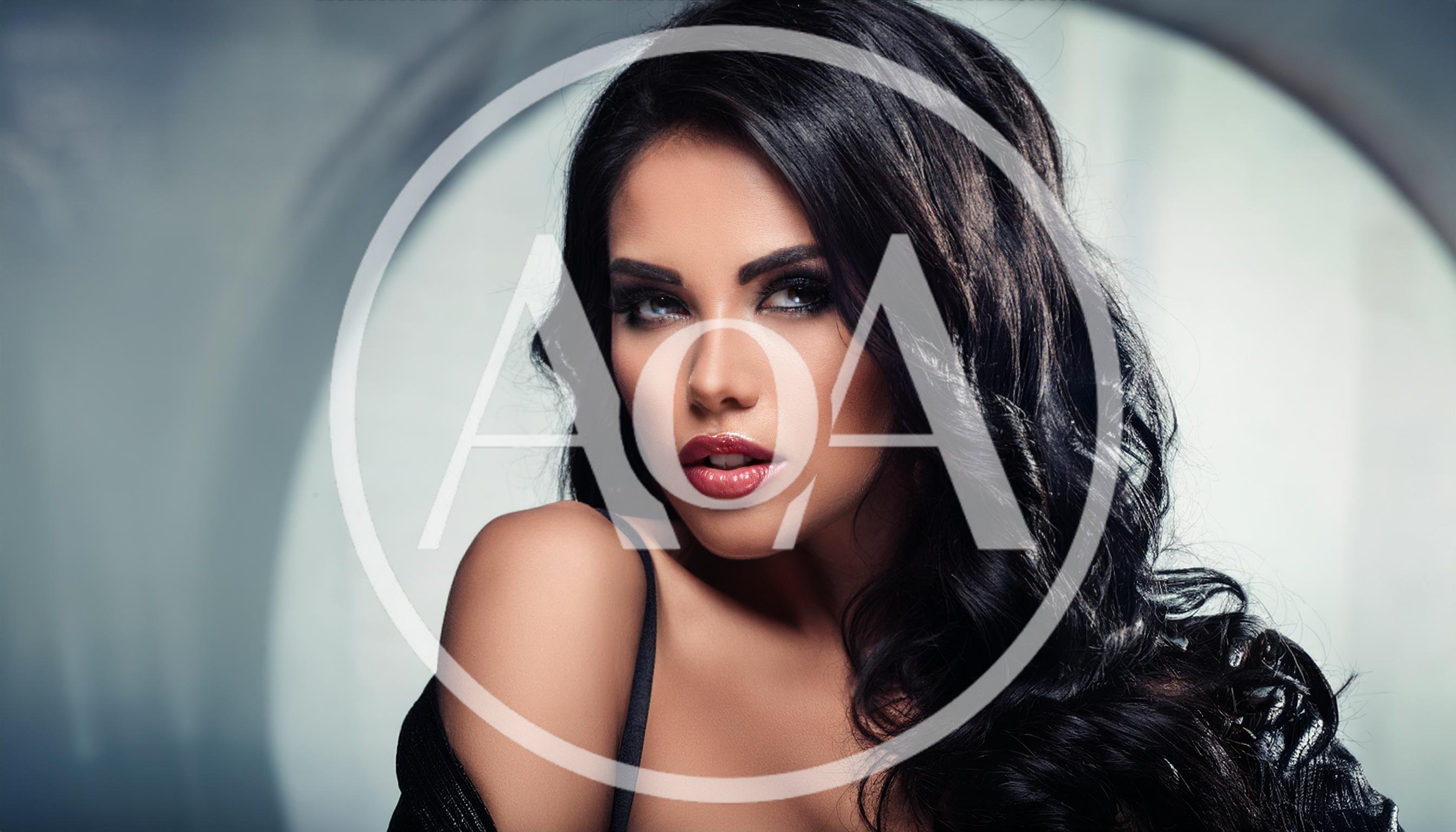 Portrait Of A Glamorous Woman With Dark Wavy Hair
