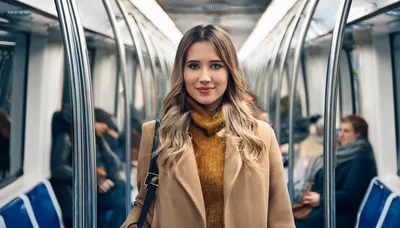 Young Woman Standing Inside A Modern Subway Train