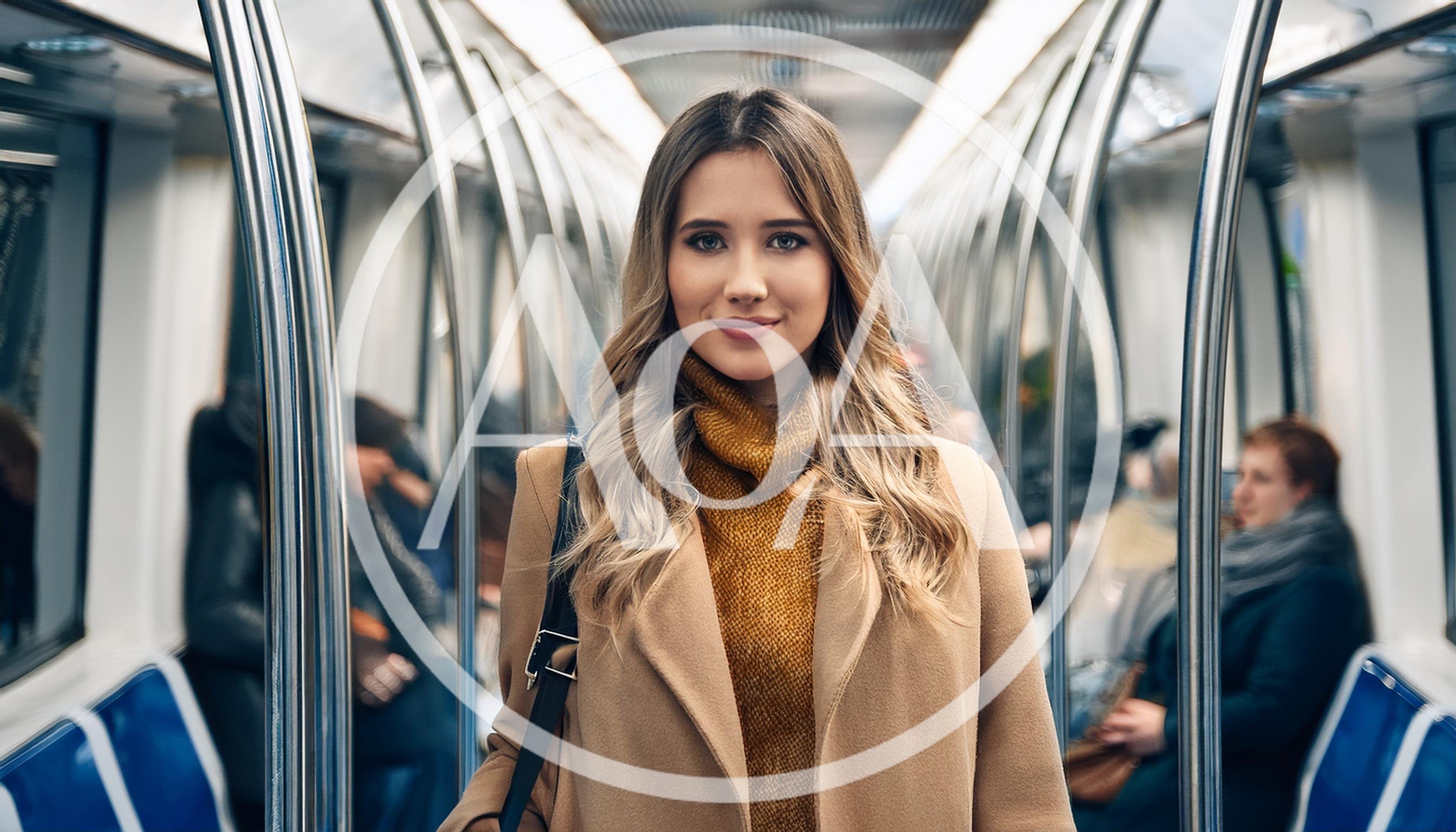 Young Woman Standing Inside A Modern Subway Train
