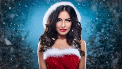 Beautiful Woman Wearing Santa Claus Costume In Snowy Forest