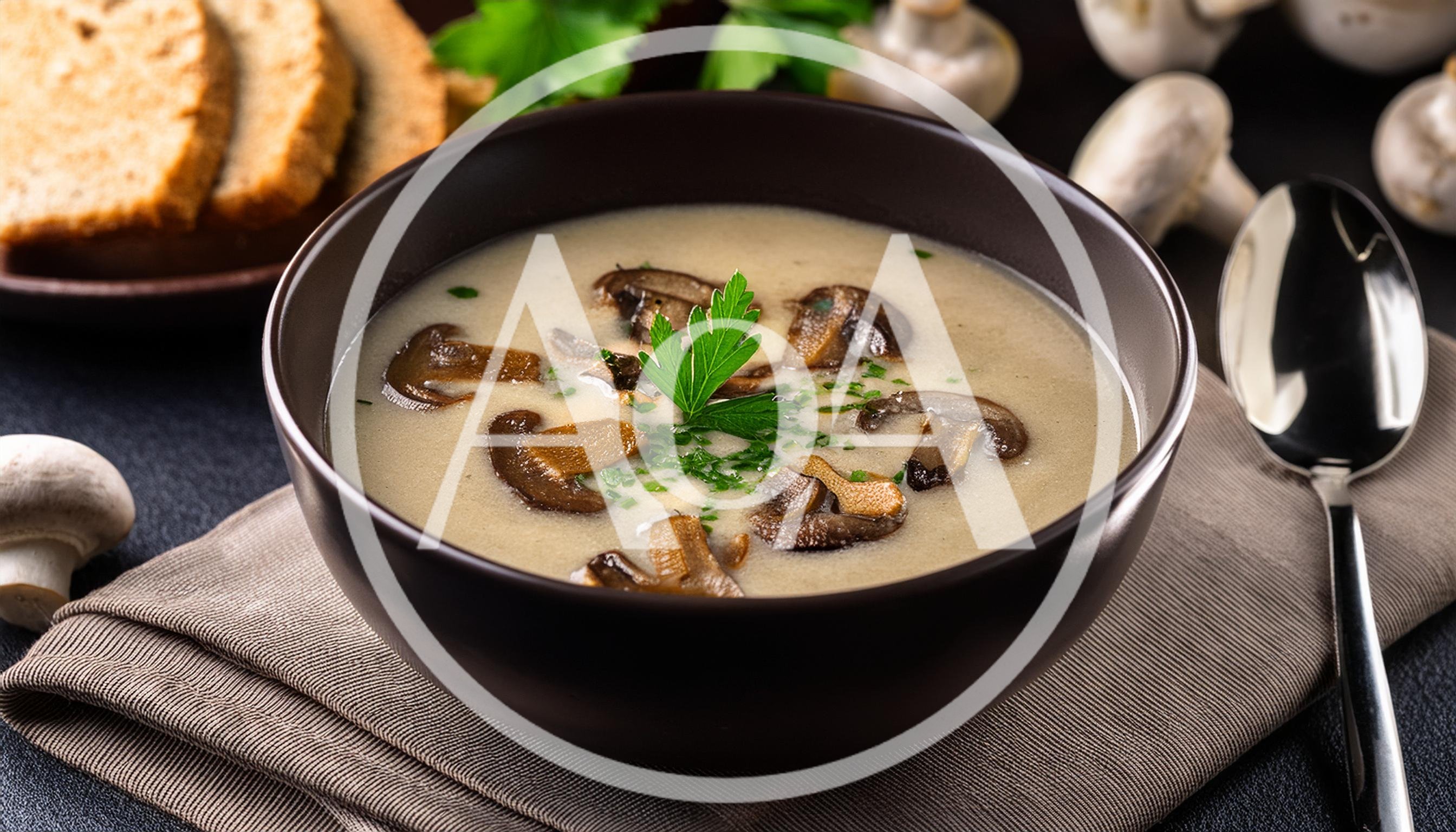 Creamy Mushroom Soup Served In A Dark Bowl