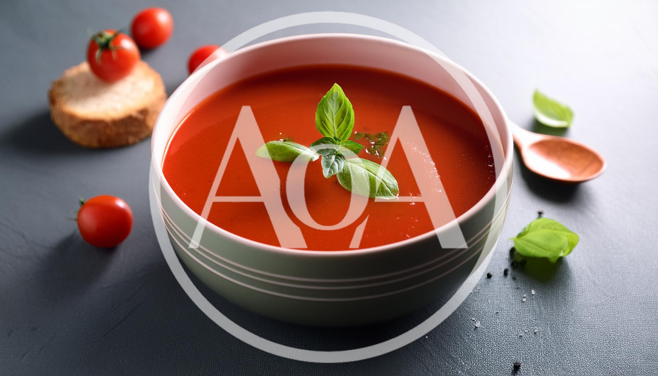 Bowl Of Tomato Soup With Fresh Basil Garnish