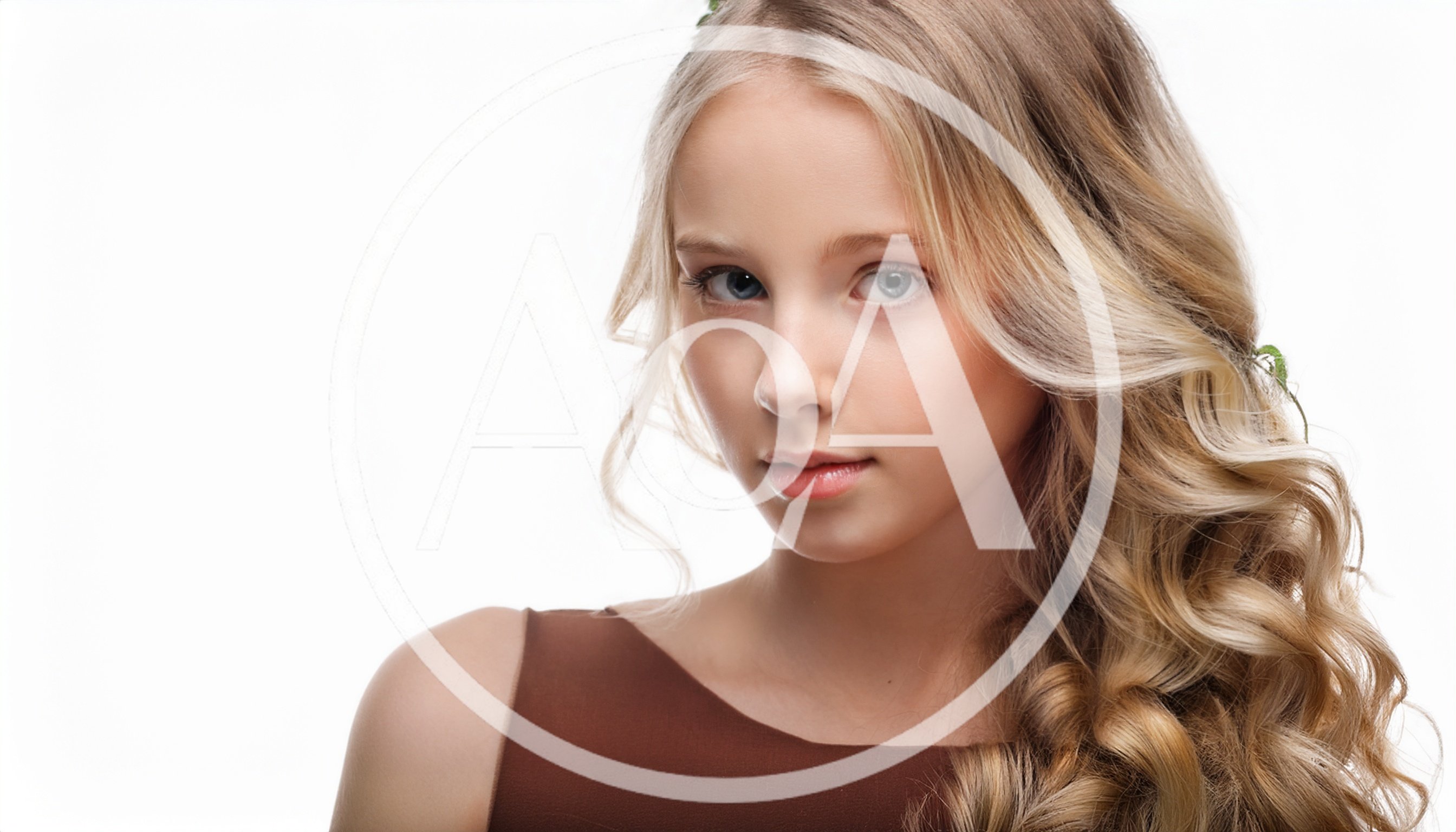 Portrait Of A Young Blonde Girl With Wavy Hair