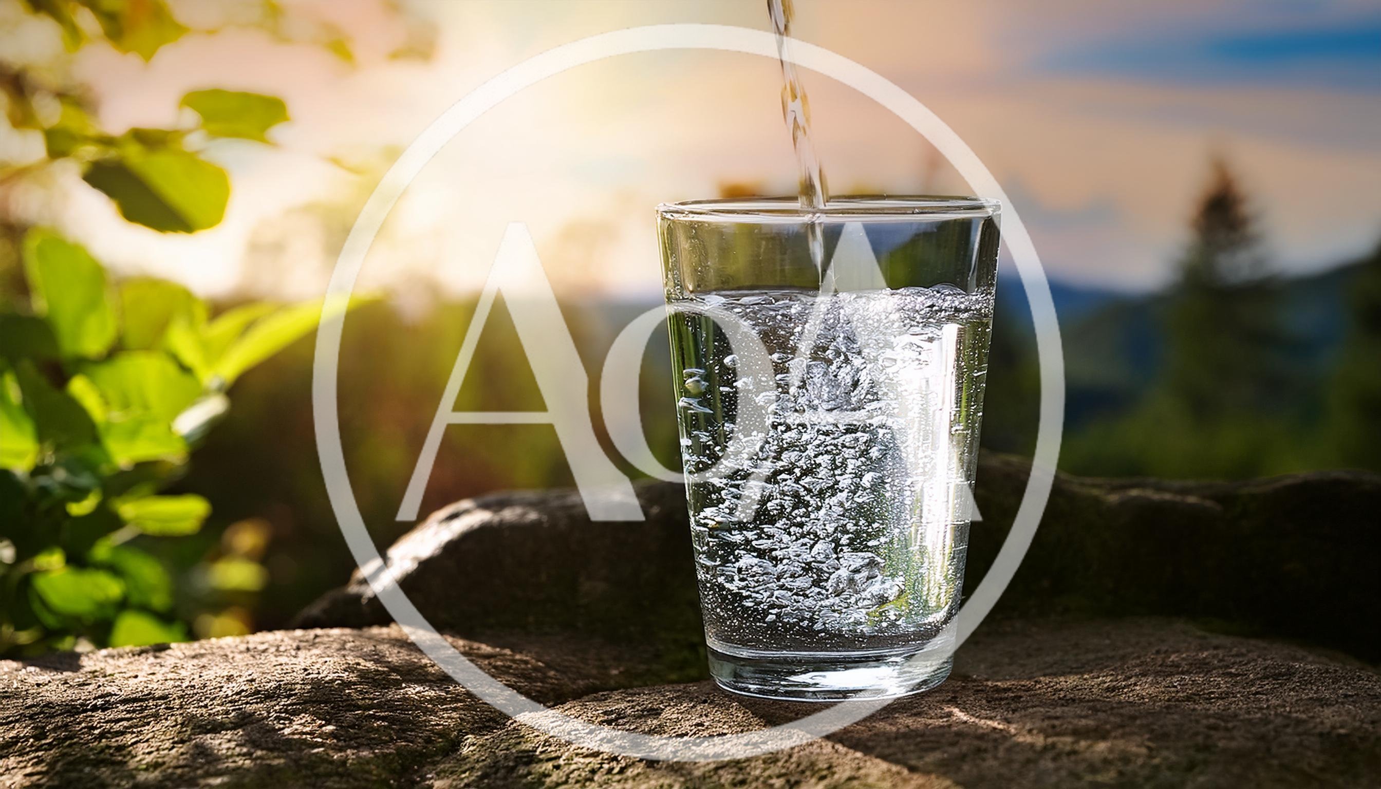 Clear Water Pouring Into A Glass Outdoors