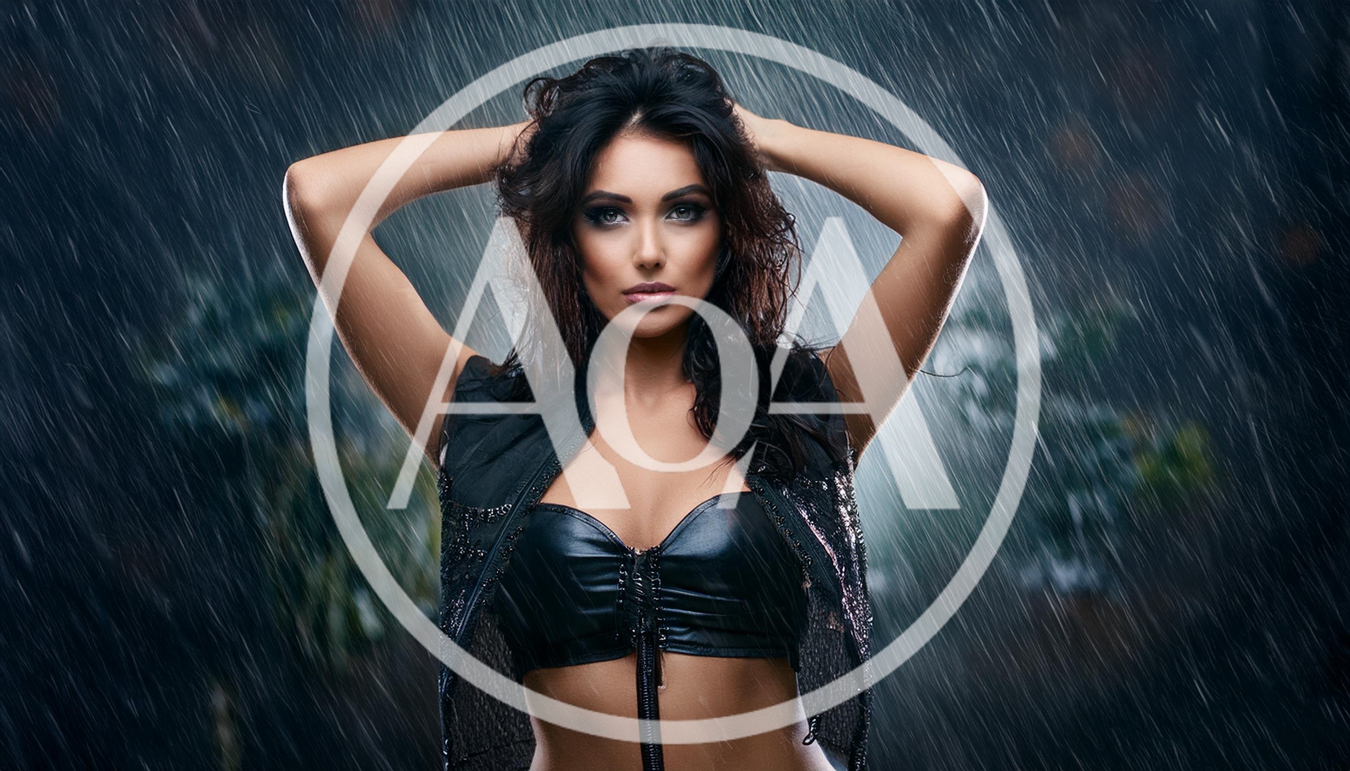 Beautiful Woman Posing In The Rain