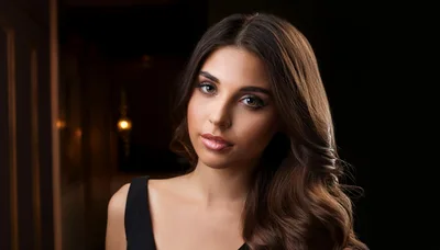 Portrait Of A Beautiful Young Woman With Wavy Hair