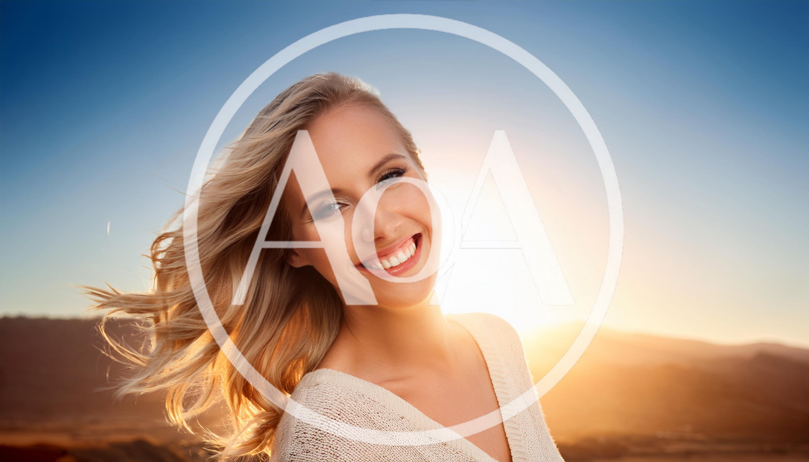 Smiling Blonde Woman With Windblown Hair At Sunset