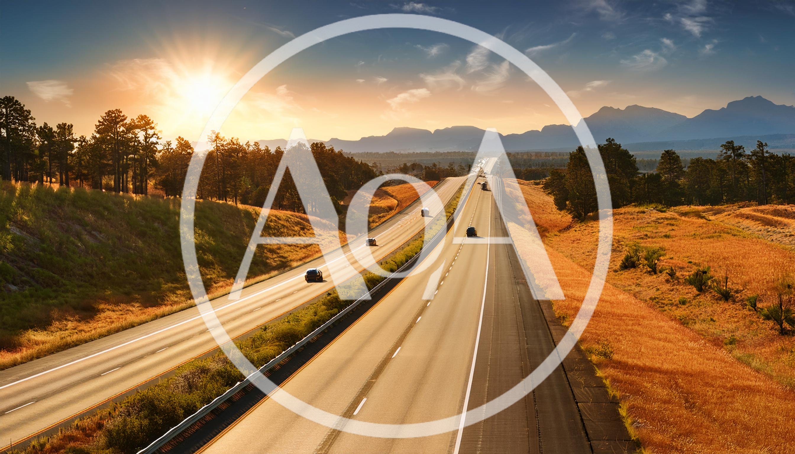 Cars Driving on Highway Through Scenic Mountain Landscape