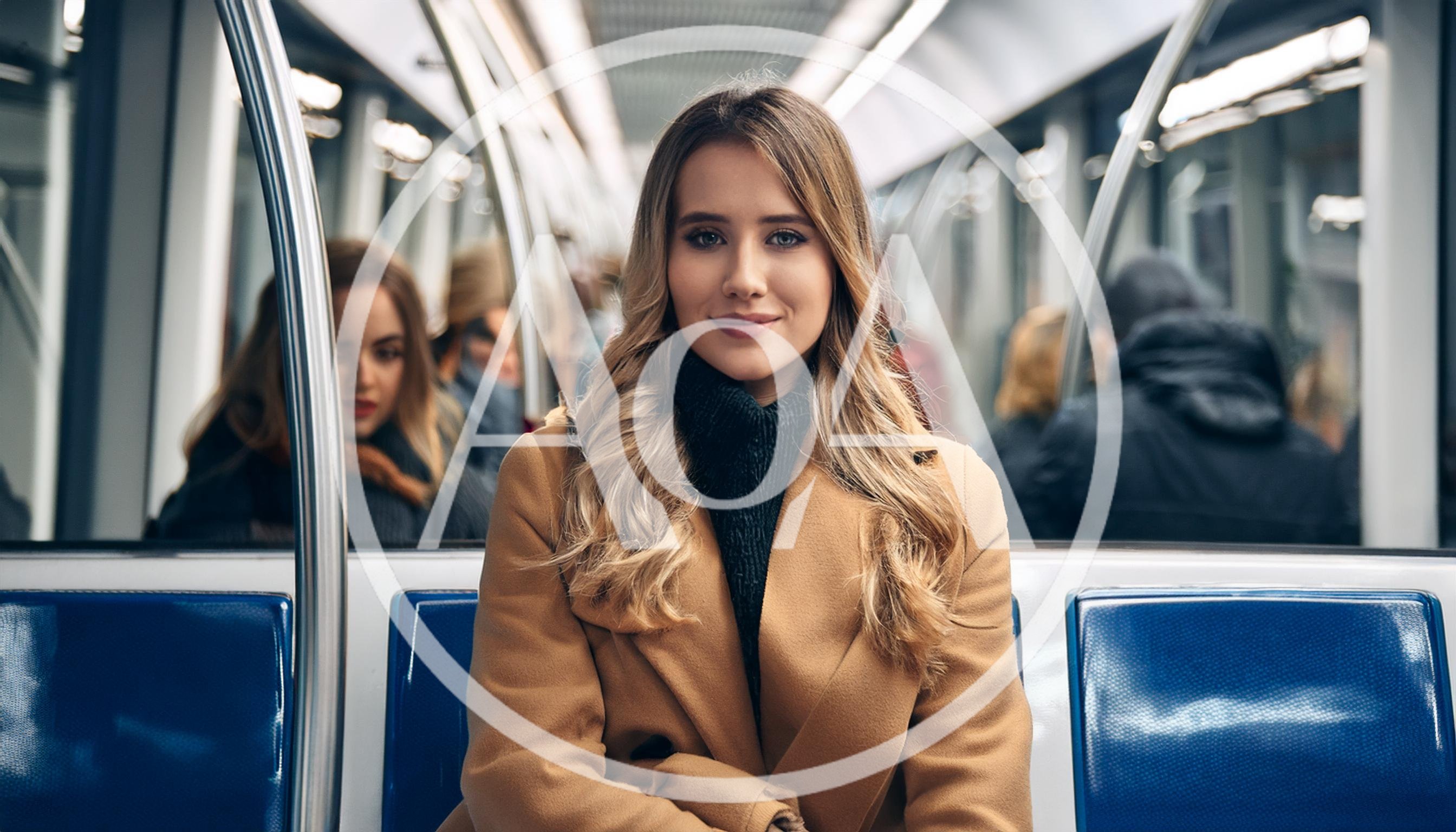 Young Woman Sitting On A Subway Train