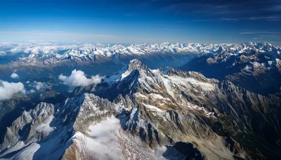 Aerial View of Snow Covered Alpine Mountain Peaks