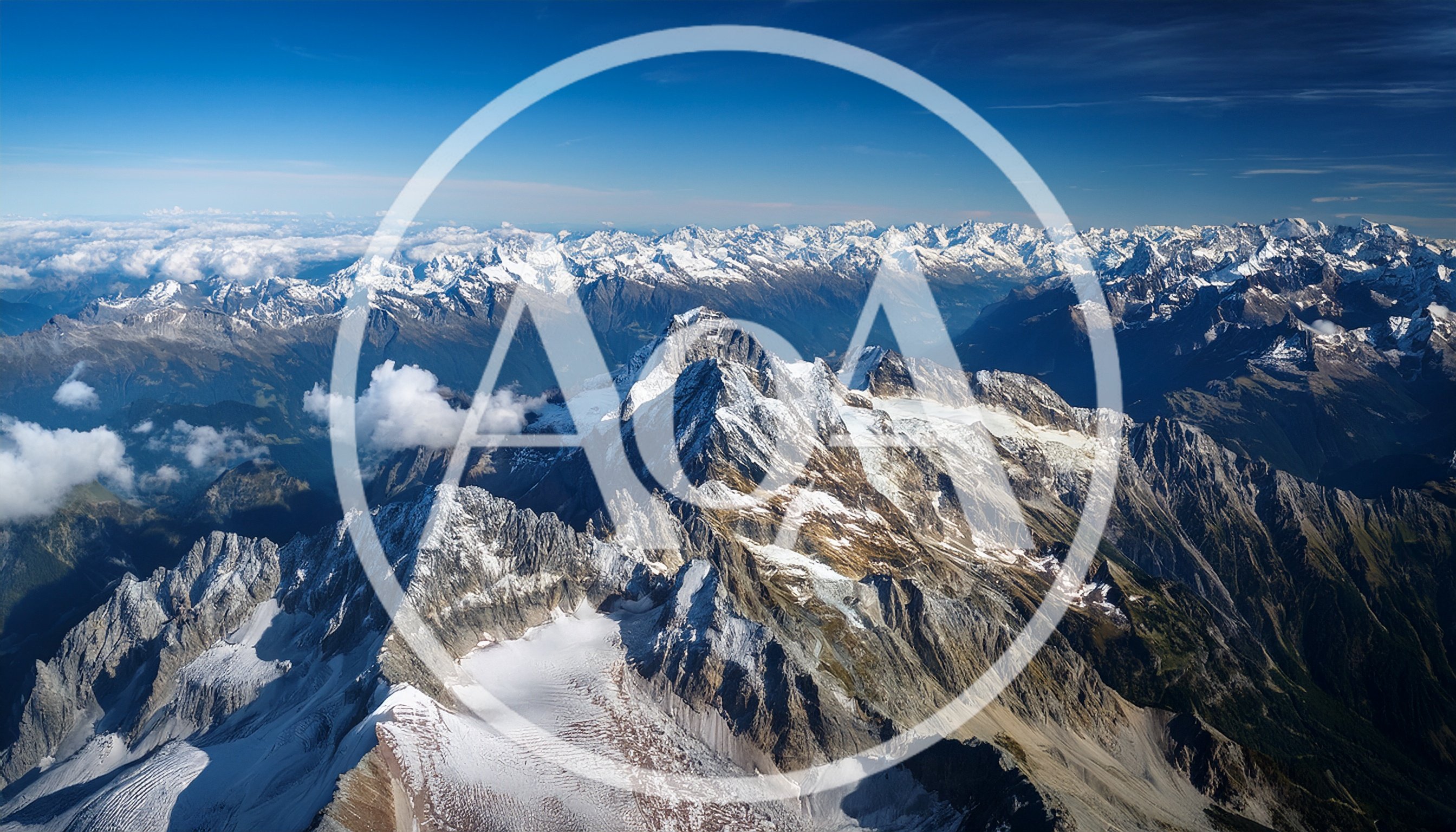 Aerial View of Snow Covered Alpine Mountain Peaks