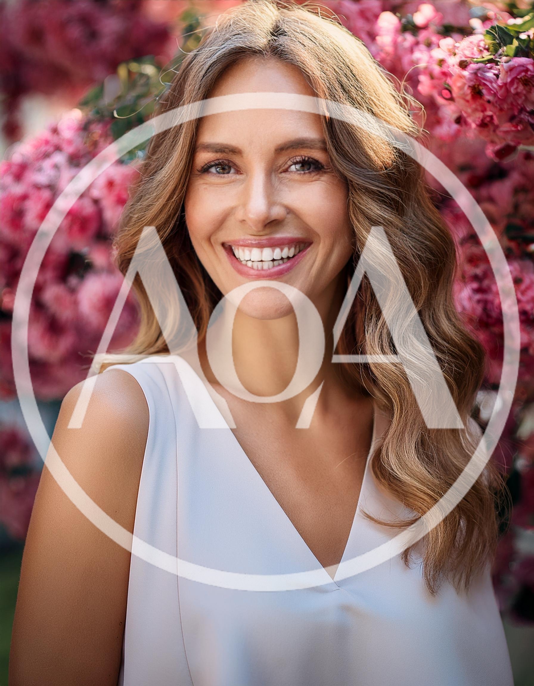 Smiling Woman With Wavy Hair In Floral Garden