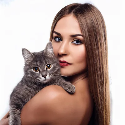Beautiful Woman Holding A Gray Tabby Cat