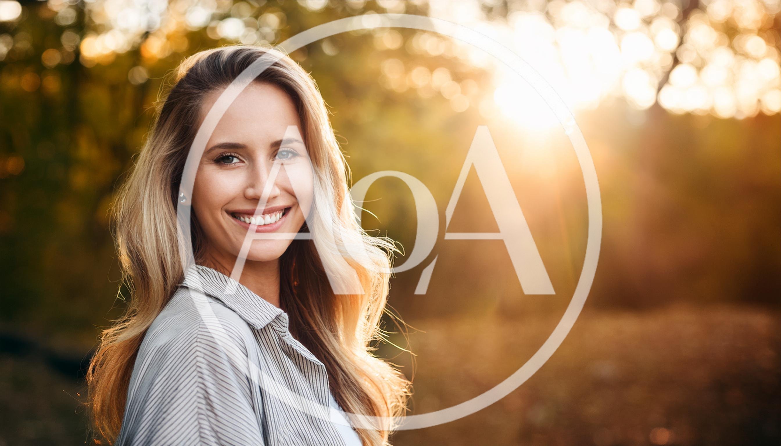 Smiling Blonde Woman Outdoors During Golden Hour