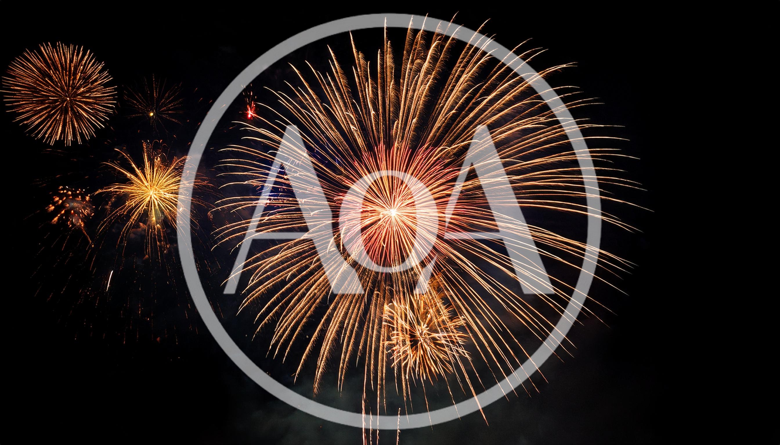Golden Fireworks Bursting Against Dark Night Sky