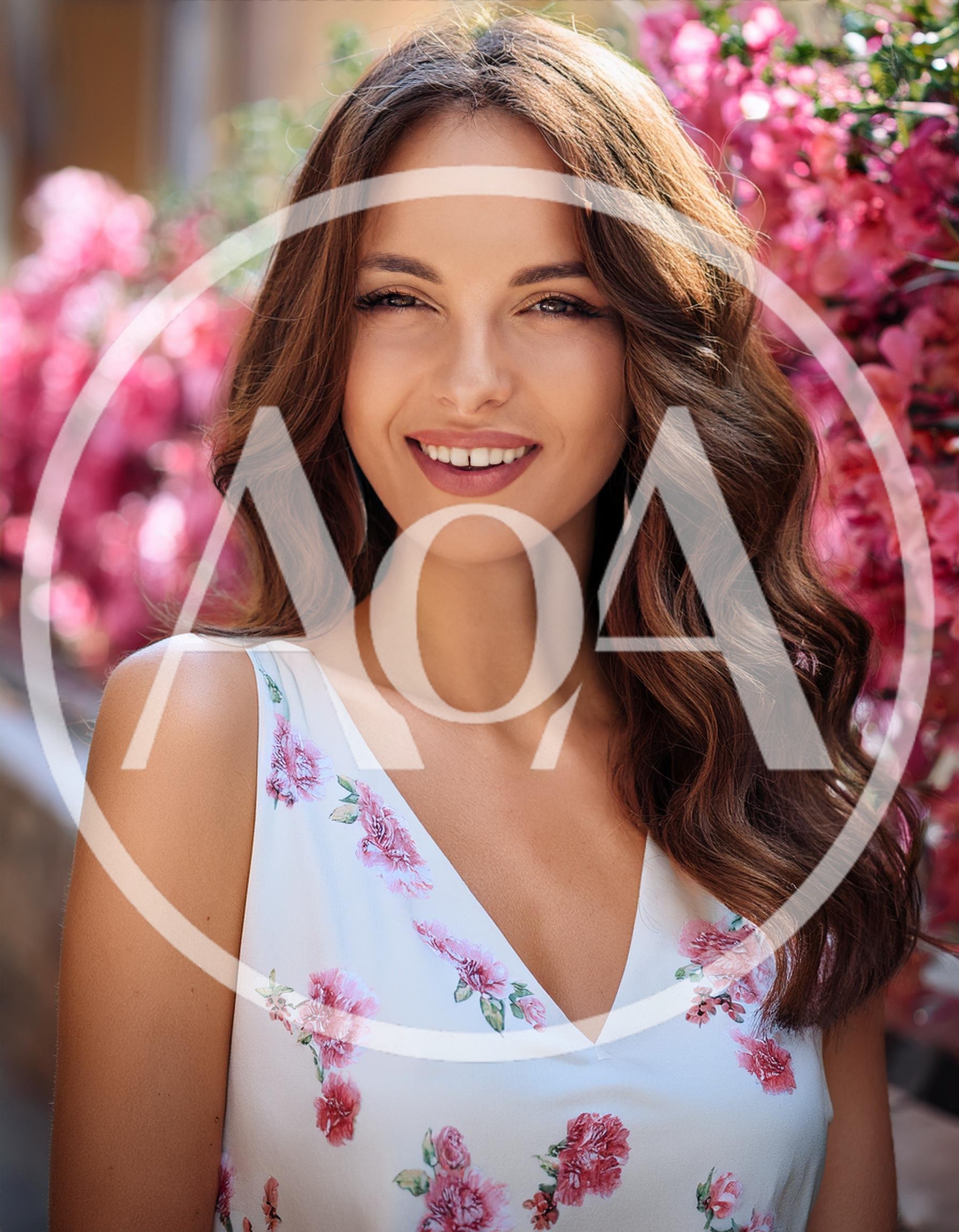 Portrait Of A Smiling Woman In A Floral Dress