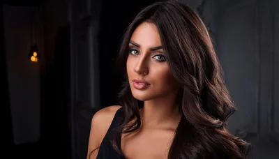 Portrait Of A Beautiful Woman With Long Wavy Hair