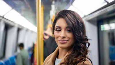Young Woman Commuting on a Modern Subway Train
