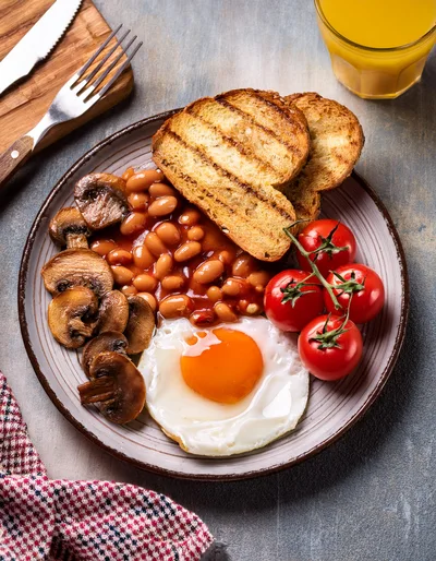 Traditional English Breakfast Plate with Fried Egg and Beans