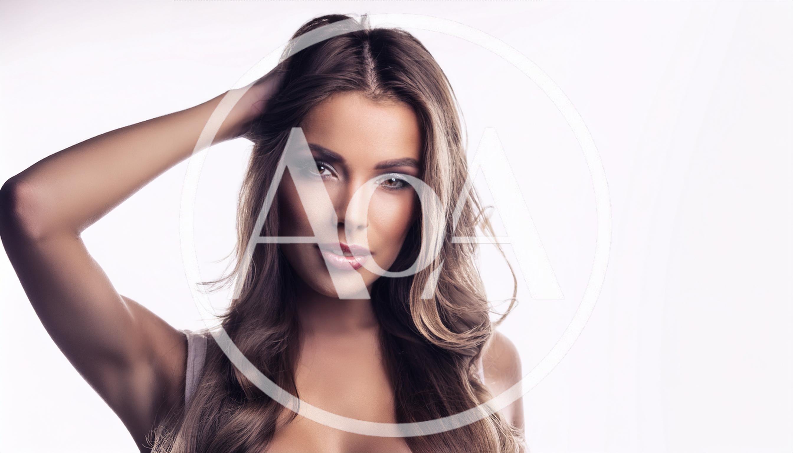 Portrait Of A Beautiful Young Woman With Long Hair