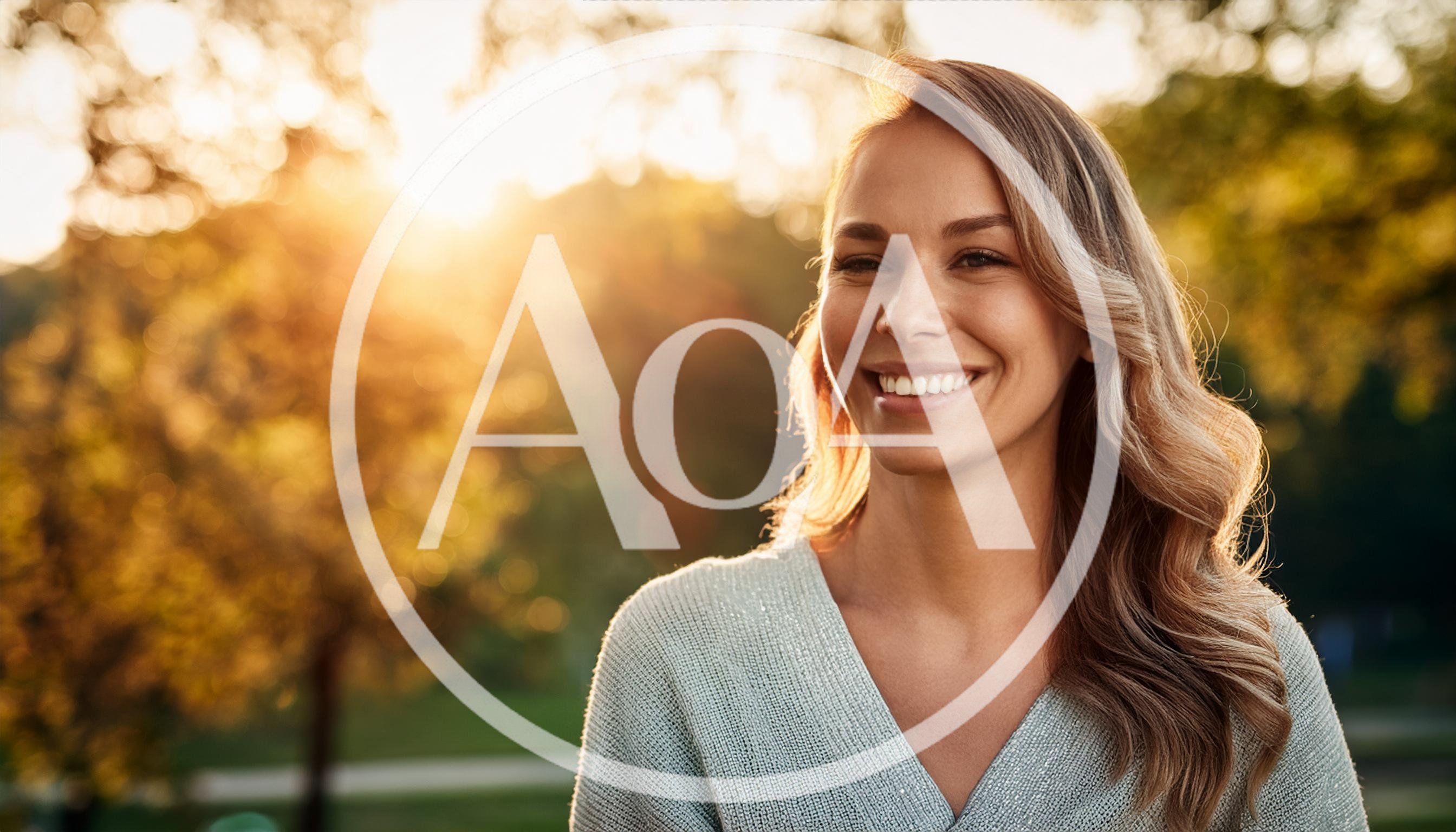 Smiling Woman Enjoying Golden Hour Sunlight In Park