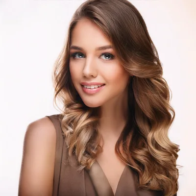 Portrait Of A Smiling Young Woman With Wavy Hair