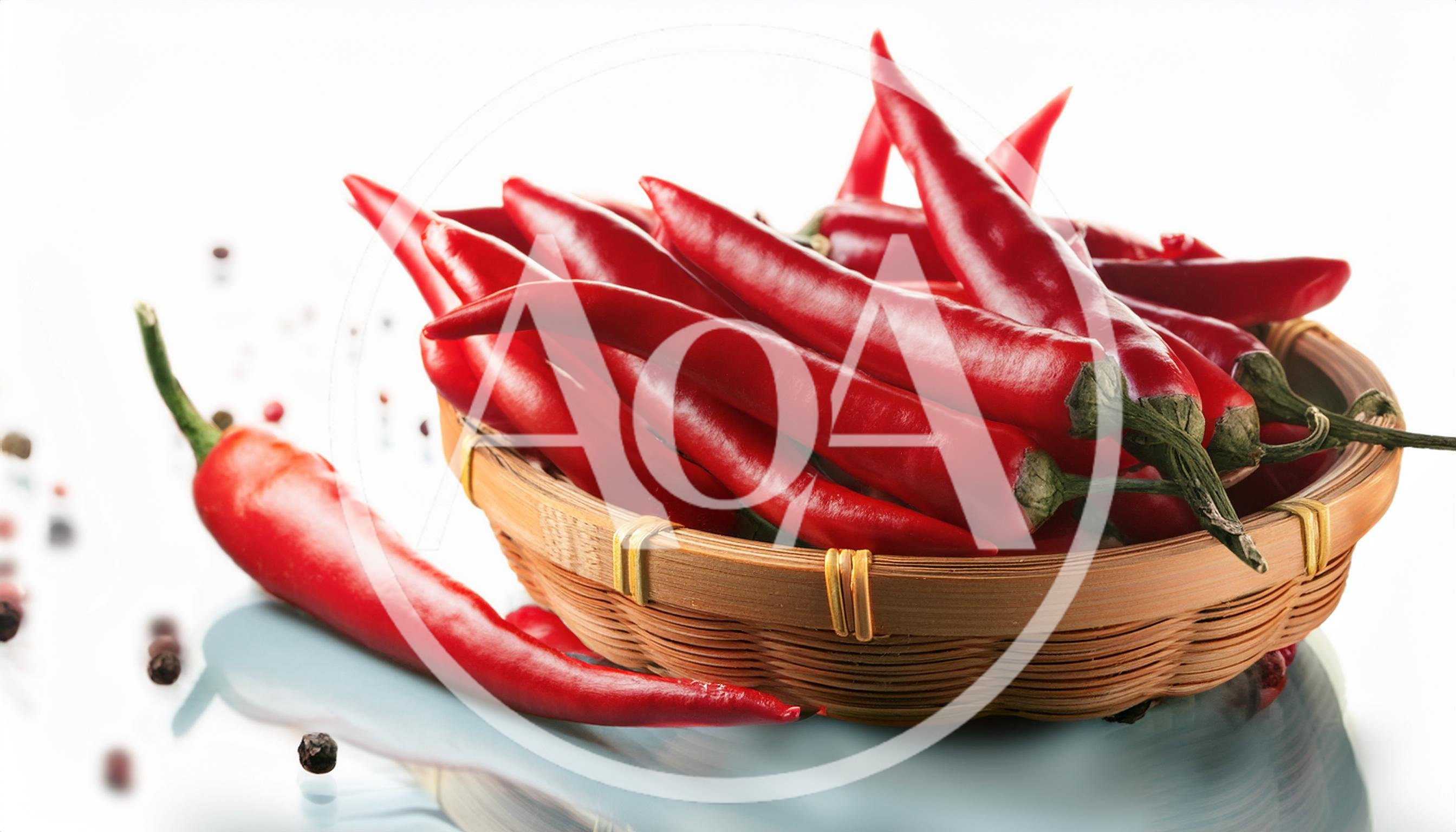 Fresh Red Chili Peppers In A Woven Basket