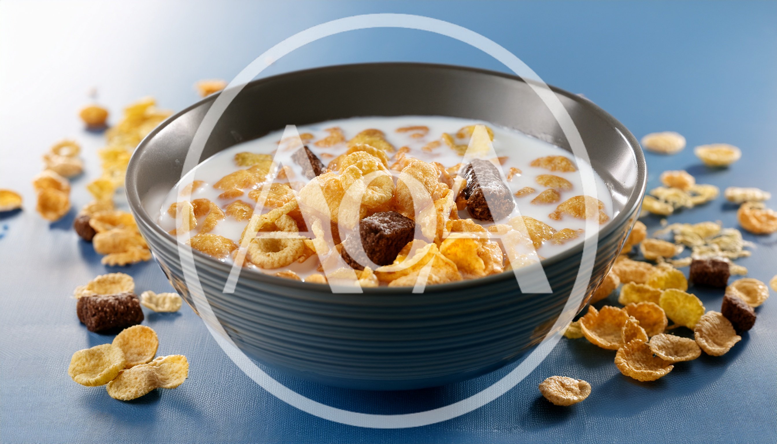 Bowl Of Cereal With Milk On Blue Background