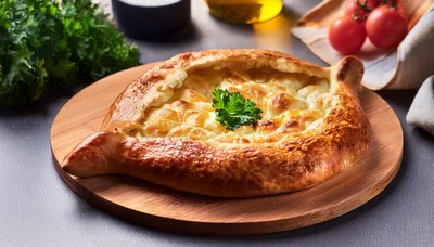 Freshly Baked Khachapuri Cheese Bread on Wooden Board