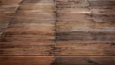 Dark Brown Grooved Wooden Decking Surface