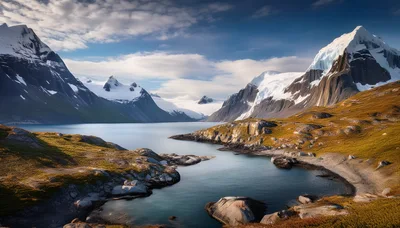 Glacial Lake Surrounded By Snow Capped Mountains