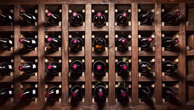 Wine Bottles Stored In A Wooden Rack