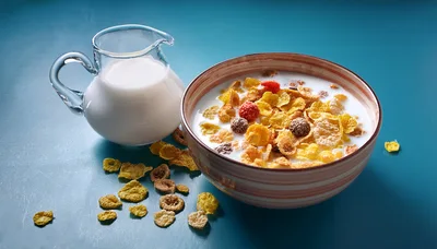 Bowl of Cereal with Milk Pitcher