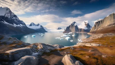 Glacial Lake Surrounded By Snow Capped Mountains