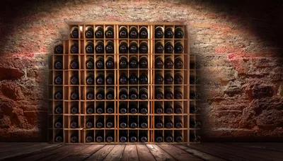 Wine Bottles Stored In A Rustic Wooden Rack